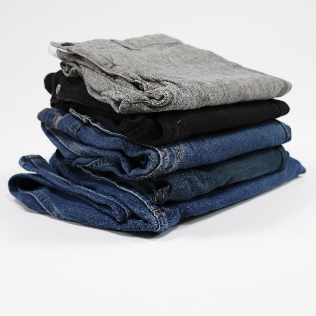 pile of denim jeans for wholesale clothing companies