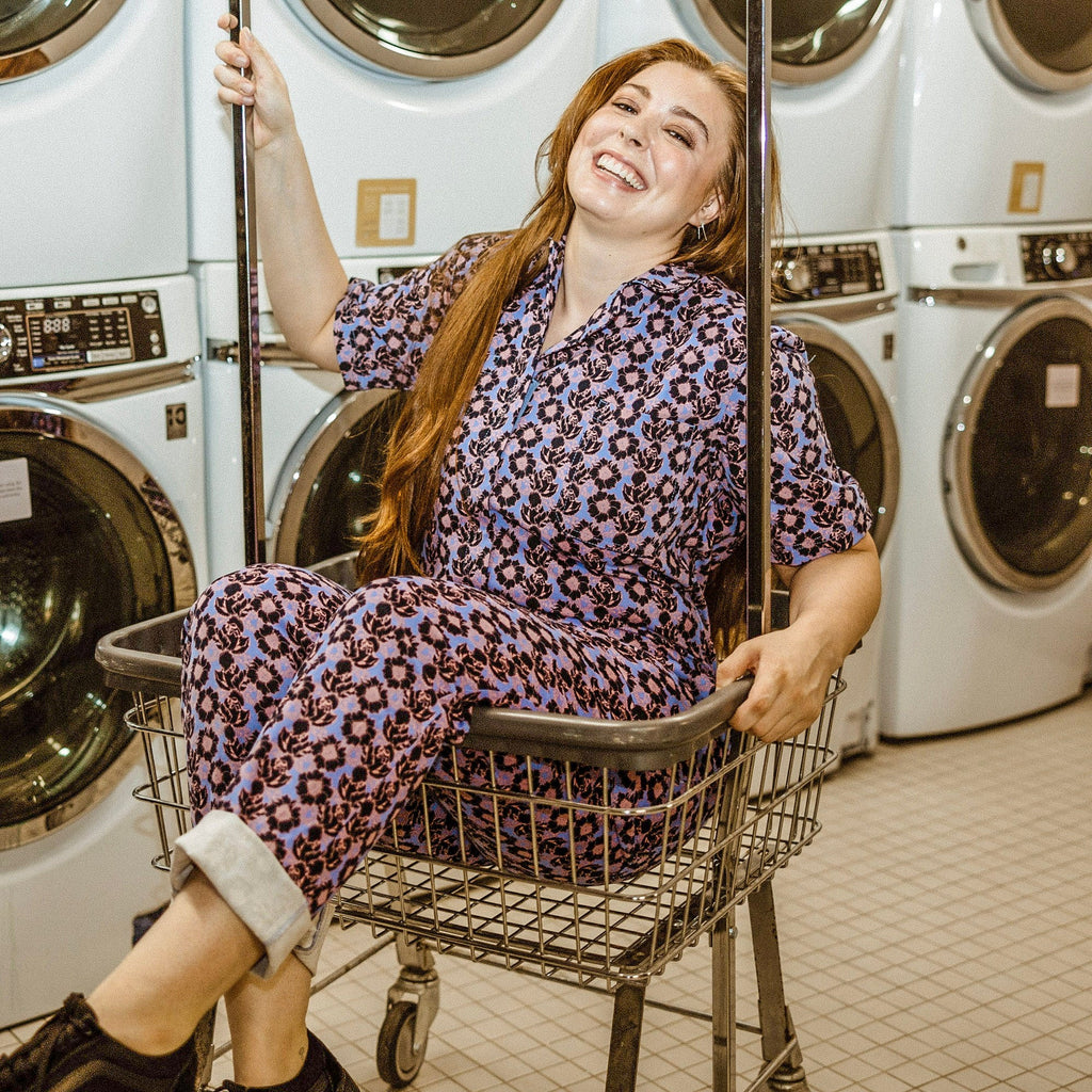 A woman in a laundry room cart